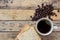 Coffee,slice of bread and coffee beans on wooden table