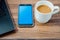 Coffee, smart phone, and laptop