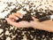 Coffee in syringe and coffee beans on wooden