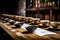 Coffee tasting session, with cups of coffee lined up on a rustic wooden table, highlighting the nuances and flavors of different