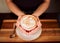 Coffee, tea and cappuccino drink in hands of a waiter working in coffee shop, cafe and restaurant. Closeup of server