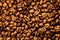Coffee texture. Roasted coffee beans as background wallpaper. Beautiful arabica real cofee bean illustration for any concept. Gour