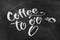 Coffee to go chalk lettering on blackboard.