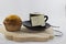 Coffee on tray with muffin with white background