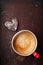 Coffee in unusual vintage tin mug with glass heart
