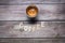 Coffee wooden letters on a wooden board with an espresso creamy coffee served on a mug