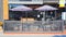 Coffeeshop entrance, Joplin, Missouri, with patio seating and umbrellas