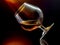 Cognac in tilted wineglass