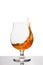 Cognac in wineglass isolated on white