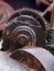 Cogwheel and gear teeth on ancient rusted broken industrial machinery