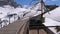 Cogwheel train rides in the snowy mountains on the railway. Switzerland, Alps