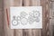 Cogwheels hand drawn illustration on paper sheet