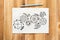 Cogwheels hand drawn illustration on paper sheet