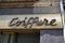 Coiffure signboard in street means in french hairdresser barber shop in wall facade entrance street