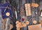 coil of brown rope, paper tags and old scissors on a gray wooden background