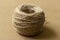 A coil of jute rope used for needlework