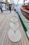 Coil of mooring nautical rope (hemp) folded in helix shape seen on deck of a vessel in Antwerp, Belgium