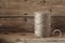 Coil of rope twine on a wooden background closeup