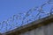 Coils of barbed wire with spikes closeup