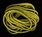 Coils of yellow, nylon rope on black