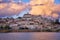 Coimbra city view at sunset with Mondego river and beautiful historic buildings, in Portugal