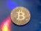 Coin bitcoin on a brilliant close-up background