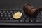 Coin bitcoin with judge hammer on keyboard. Litigation, Online Cryptocurrency Fraud