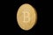 Coin bitcoin made of gold, isolated on a black background