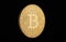 Coin bitcoin made of gold, isolated on a black background