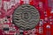 Coin bitcoin is rusty. Against the background of the video card