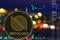 Coin cryptocurrency Ontology ONT on night city background and chart.