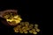 Coin gold in lady hand on lots stacking golden coins in broken jar white background