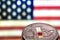 Coin of litecoin on an American flag background, the concept of