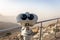 Coin operated binoculars at Jebel Jais Viewing Deck Park overlooking Hajar Mountains, UAE