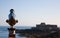 Coin operated viewfinder telescope overlooking sea