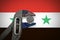 The coin in vise on the background of flag of Syria