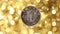 A coin in yuan on a gold background