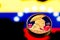 coins Bitcoin, amid Colombia flag, concept of virtual money, close-up. Conceptual image.