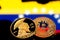 Coins Bitcoin, amid Colombia flag, concept of virtual money, close-up. Conceptual image.