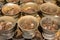 A coins in cups, financial gifts of believers in buddhist temple