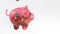 Coins fall into a pink glass piggy bank - a symbol of wealth, frugality and effective investment planning. Symbol of financial suc