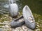 Coins in fountain with stone shoes