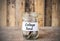 Coins in glass money jar with college fund label, financial concept.