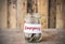 Coins in glass money jar with emergency label, financial concept