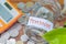 Coins in glass money jar with pension label