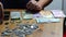 Coins on hand, coins on table, bitcoin, dirhams, euro coins, calculator and money