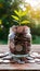 Coins in jar atop wooden surface, savings for travel adventures