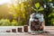 Coins in jar atop wooden surface, savings for travel adventures