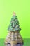 Coins, pyramid, Christmas tree. The new year holiday. Business growth concept Finance. Green background and dark .