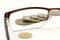 Coins seen through eyeglasses